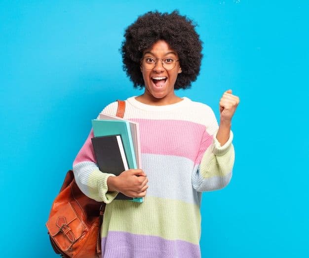 Woman with books smiling